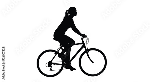 Woman riding a bicycle in a striking black silhouette