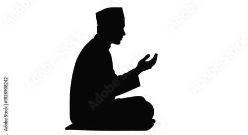 A kneeling man with hands raised in prayer a striking silhouette