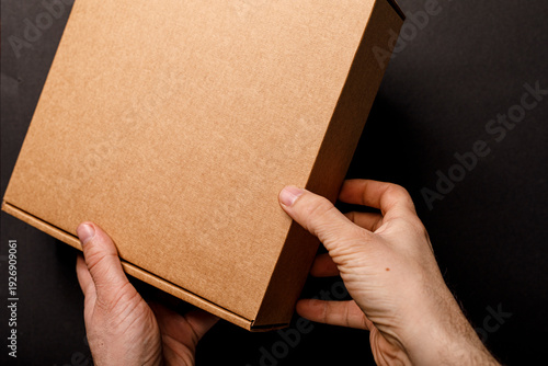 Close-up of hands holding a...