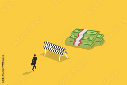 Businessman walking toward a large stack of money behind a road barrier, representing financial goals, overcoming obstacles, and wealth