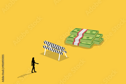Business woman walking toward a large stack of money behind a road barrier, representing financial goals, overcoming obstacles, and wealth