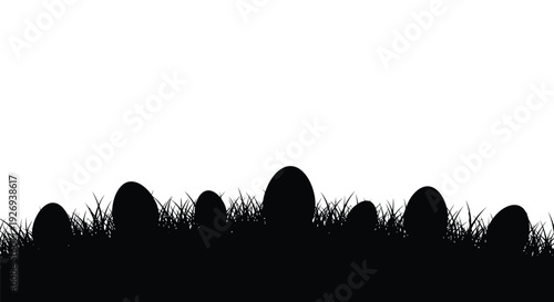 Silhouette of Easter eggs hidden in the grass on a white background.