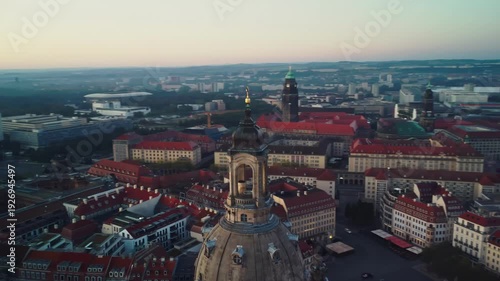 A circular aerial shoot of the Frauenkirche with Dresden's Old Town  behind in Dresden in Germany at dawn