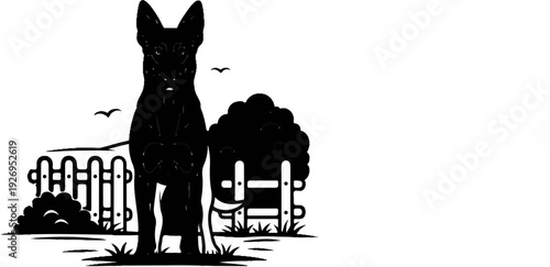 Black silhouette of a dog in a yard with a fence and bushes
