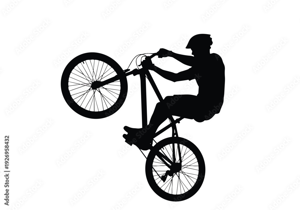 Fototapeta premium Bicycle stunt silhouette illustration. Person performing a wheelie on a bike. Extreme sport and balance concept.