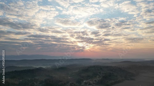 Aerial Timelapse of Dramatic Sunset Clouds Over Mountain Landscape from Drone