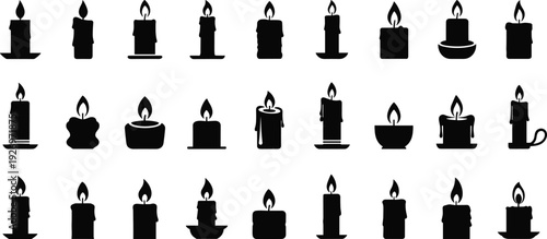 Collection of various lit candles in different shapes and sizes