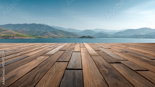 Scenic mountain view overlooking lake from wooden deck.