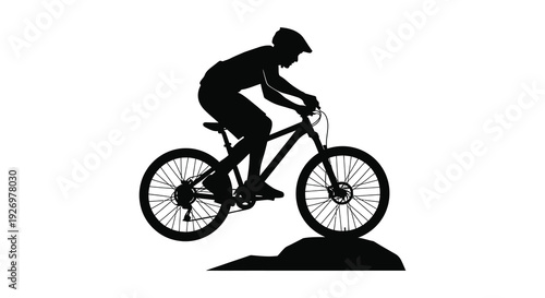 A cyclist rides a mountain bike captured in a striking black silhouette emphasizing dynamic movement and form high quality professional detailed