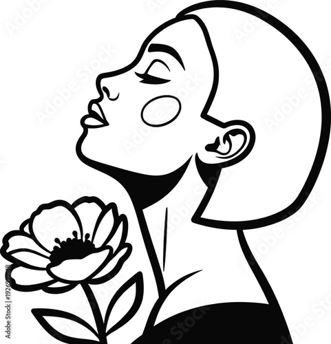 Woman smelling a flower in profile view