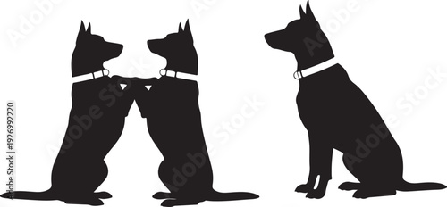 Three black dogs with red collars in a playful and affectionate pose