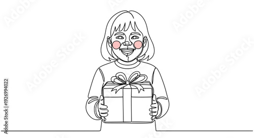 Happy girl holding gift box with bow