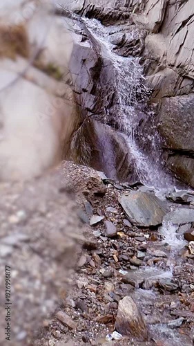Blurred Slow Motion Scenic Cliffside Waterfall in Wilderness Area
