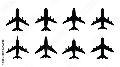 Collection of eight airplane silhouettes in various orientations on white background for design and travel concepts