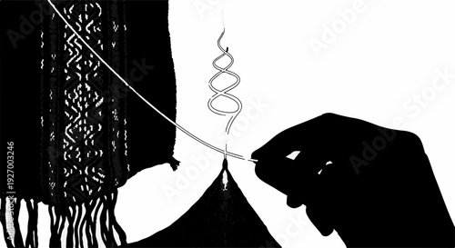 Close-up of a hand carefully threading a needle through intricate fabric with a delicate pattern.