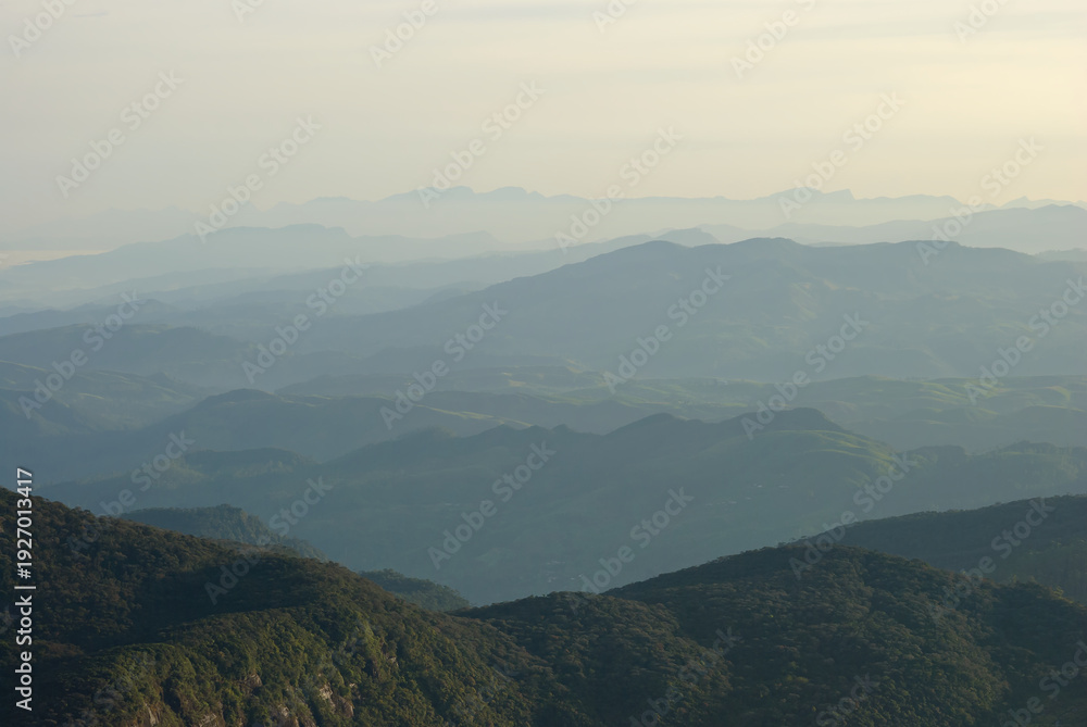 Fototapeta premium Panoramic View of Misty Mountain Ranges from Adam's Peak Sri Lanka
