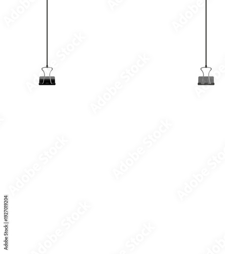 A blank white sheet of paper is suspended by black binder clips and strings against a dark background, ready for content