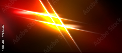 Bright light streaks cross dark background. Vivid orange, yellow hues dominate composition. Energetic visual effect.