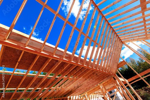 Wooden framework being built at construction site under rafters to installed