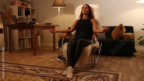 woman relaxing in rocking chair