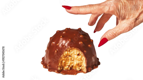 A mature person's hand wants to take another bite of a chocolate treat. Transparent background
