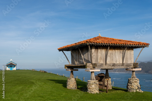 Photos A stunning landscape featuring a traditional wooden hórreo (granary) on stone pi