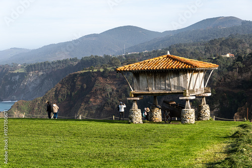 Photos A stunning landscape featuring a traditional wooden hórreo (granary) on stone pi
