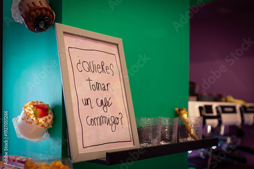 Cafe interior featuring spanish want a coffee with me? Sign