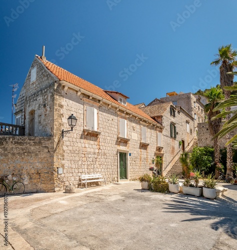Croatia, Vis Island, street and old Dalmatian houses on a sunny summer day. The historic town of Vis on the island of Vis.