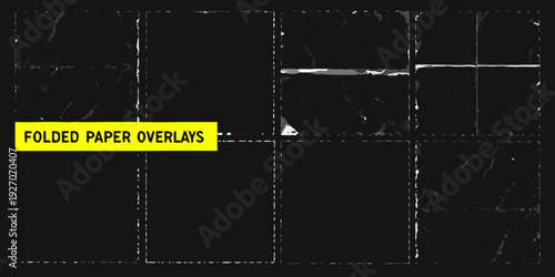 Abstract arrangement of black and white folded paper overlays with yellow text