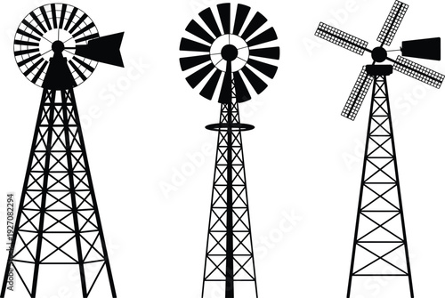 Set of three black vintage windmill silhouettes, old farm wind turbines with blades and tower structures, isolated on white background, renewable energy icons