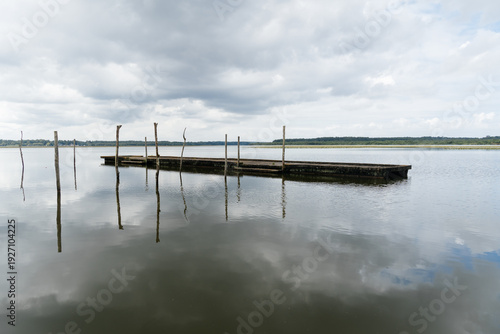 Wallpaper Mural Lake of Soustons reflecting a cloudy sky and wooden docks Torontodigital.ca