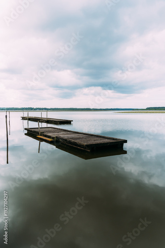 Wallpaper Mural Lake of Soustons reflecting a cloudy sky and wooden docks Torontodigital.ca
