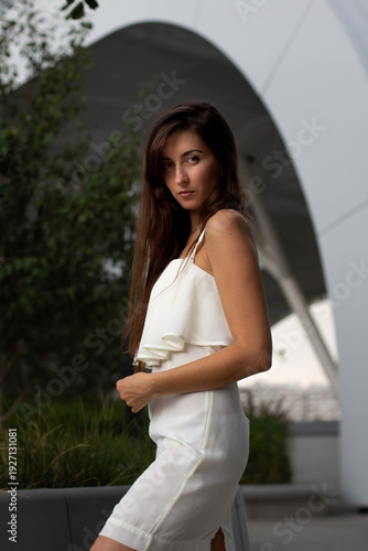 young girl against the backdrop of a beautiful ceiling in a shopping centre