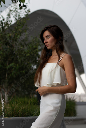 young girl against the backdrop of a beautiful ceiling in a shopping centre