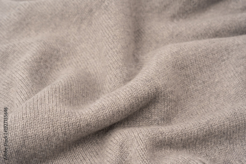 Soft grey merino wool sweater texture as a background.