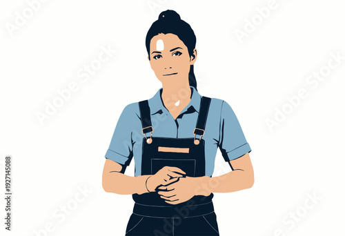 Confident Female Mechanic in Blue Coveralls and Gloves Ready for Work with Tools and Equipment in a Professional Workshop Setting
