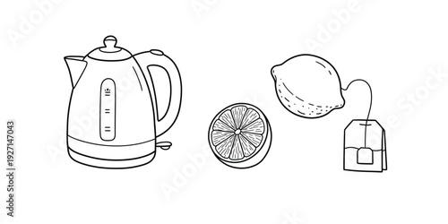 Electric kettle with lemon and tea bag for hot beverage preparation