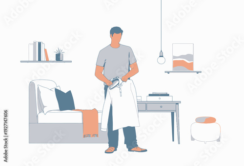 Man ironing a white shirt in a modern, minimalistic living space with cozy furniture, a stack of books, and ambient lighting for a serene atmosphere