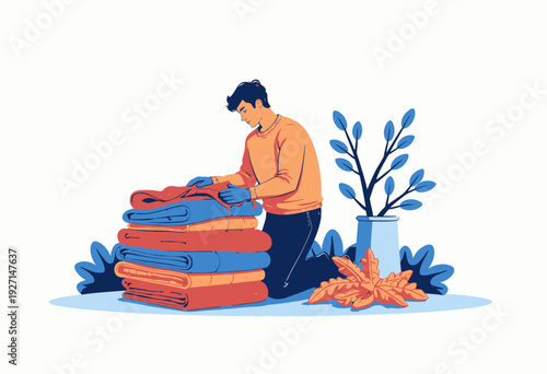 Man Organizing Folded Fabrics at Home With Leaves and Potted Plant for Seasonal Home Decoration on a Peaceful Day