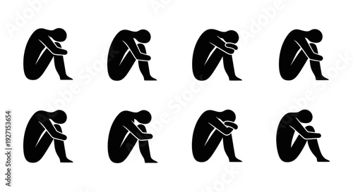 Multiple silhouettes of a person huddled and curled up, expressing sadness and despair, isolated white background.