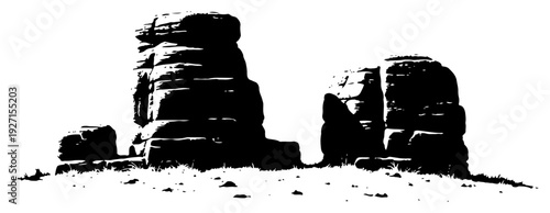High contrast silhouette of massive desert rock formations and stone pillars