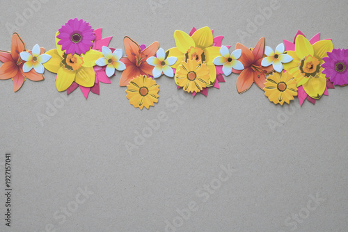 string of paper flowers on blank millboard