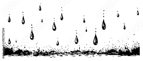 Rain drops falling into a puddle with splashes