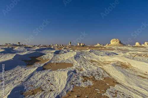 Beautiful landscape with white mineral rocks and sand in the White Desert near Farafra oasis in Egypt