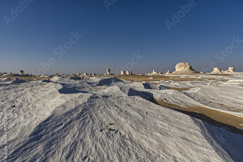 Beautiful landscape with white mineral rocks and sand in the White Desert near Farafra oasis in Egypt