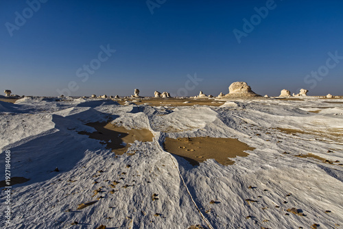 Beautiful landscape with white mineral rocks and sand in the White Desert near Farafra oasis in Egypt