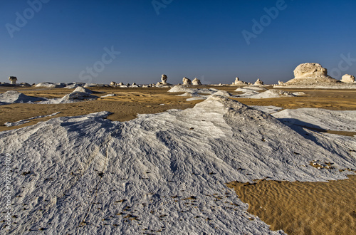 Beautiful landscape with white mineral rocks and sand in the White Desert near Farafra oasis in Egypt
