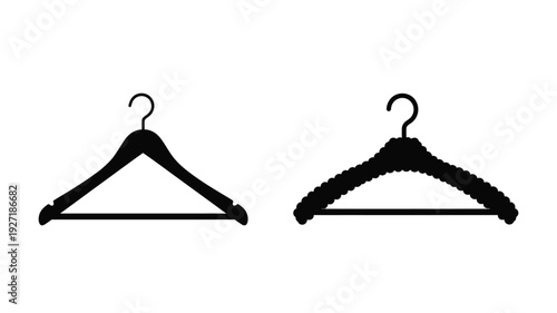 Two black clothing hangers displayed against a white background silhouette