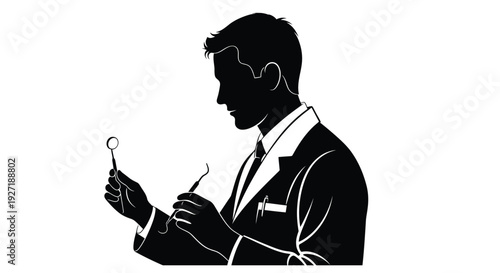Silhouette of a man in a suit examining a small object with tools